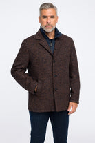 Man wearing a brown textured coat on a white background